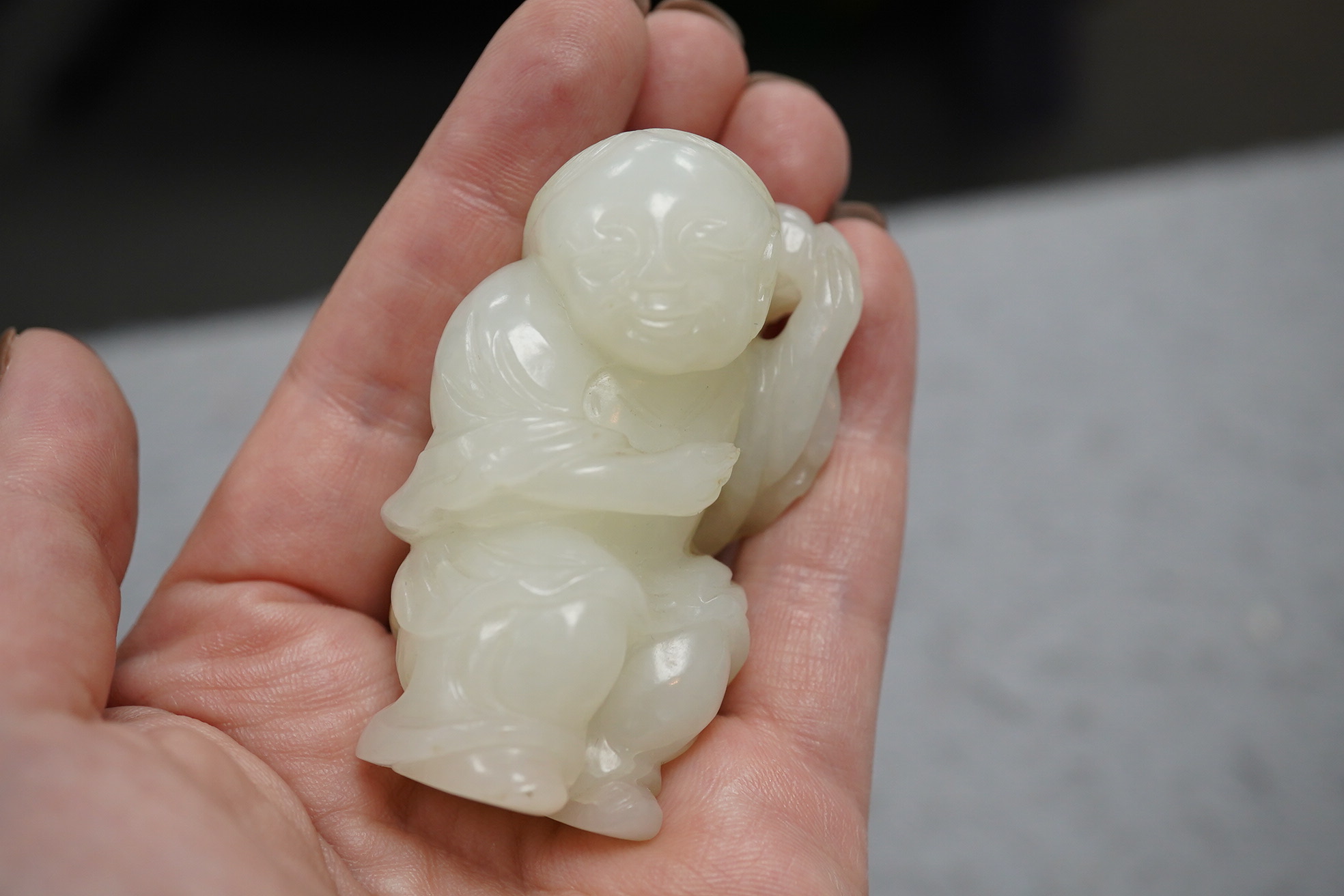 A Chinese white jade figure of Liu Hai, 18th-19th century